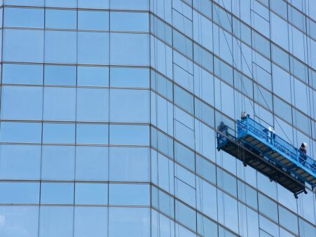 Window cleaners working on a high rise building in Bangkok